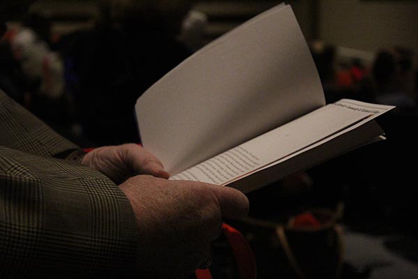Male hands holding a book