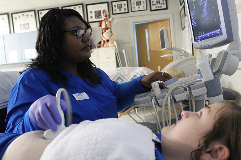 student learning how to run an ultrasound