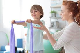 PTA helping a child with arm raises